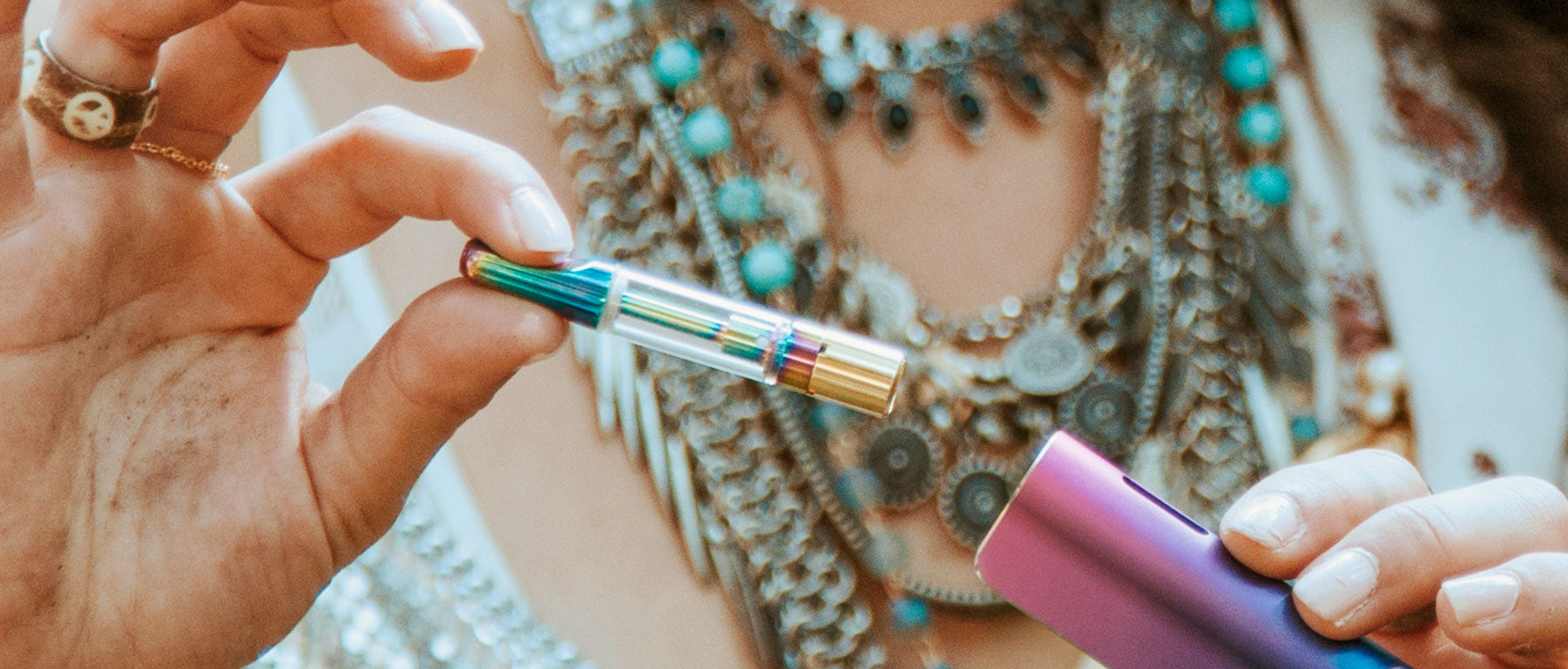 Woman holding a Cartridge Vape Pen Replacement Part with device outside